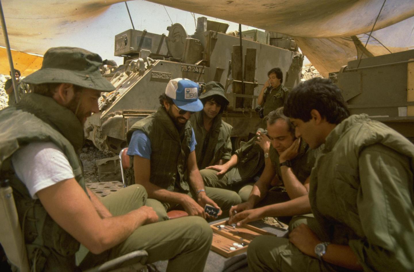 Members of 155 mm mobile gun crew play backgammon during a lull outside Beirut.