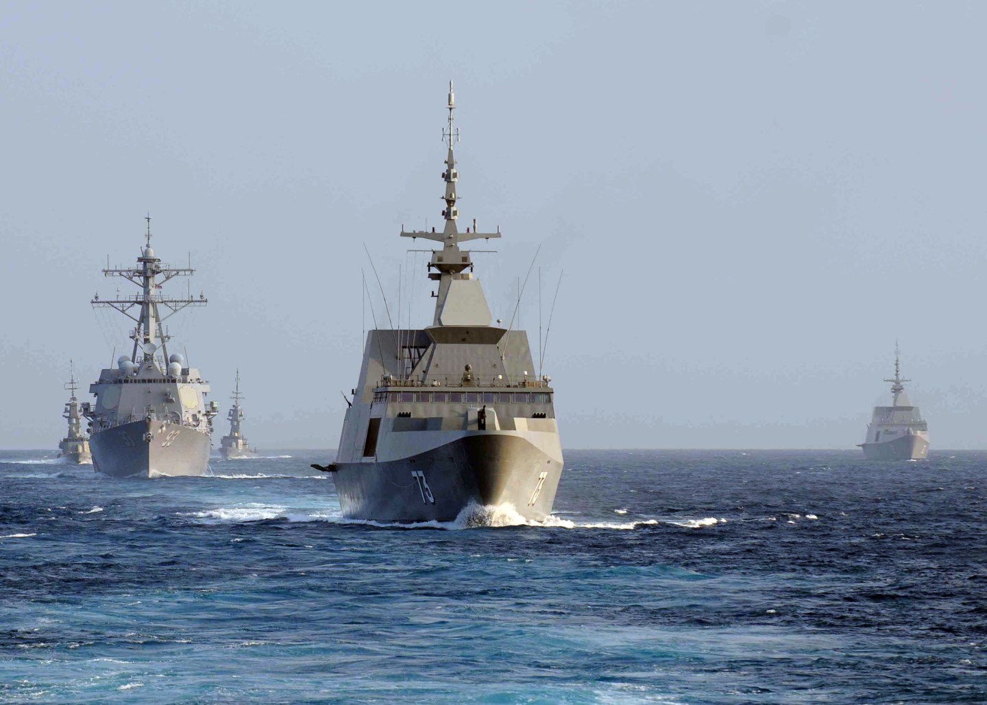The Singapore Navy frigate RSS Supreme (FFG 73), center, leads the guided missile destroyer USS Chung-Hoon (DDG 93), left, and the Singapore Navy corvette RSS Vigour (92) during maneuvers in the South China Sea Aug. 23, 2011. The ships were participating in Cooperation Afloat Readiness and Training Singapore (CARAT) 2011. CARAT is a series of bilateral exercises held annually in Southeast Asia to strengthen relationships and enhance force readiness. (DoD photo by Mass Communication Specialist 3rd Class Andrew Smith, U.S. Navy/Released)