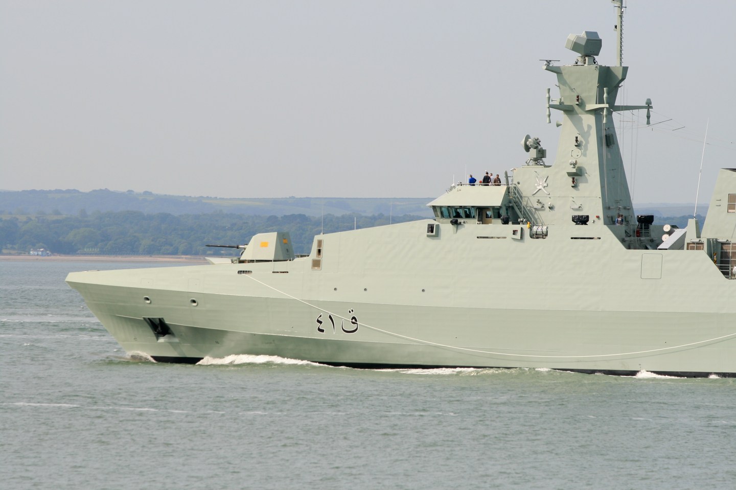 An Omani Navy corvette ONS Al Rahmani outward bound from Portsmouth Naval Base, UK, 27 June 2013 and still in builder's hands and flying the British Merchant Navy Red Ensign. A Khareef class corvette built by BAe Systems in Portsmouth.