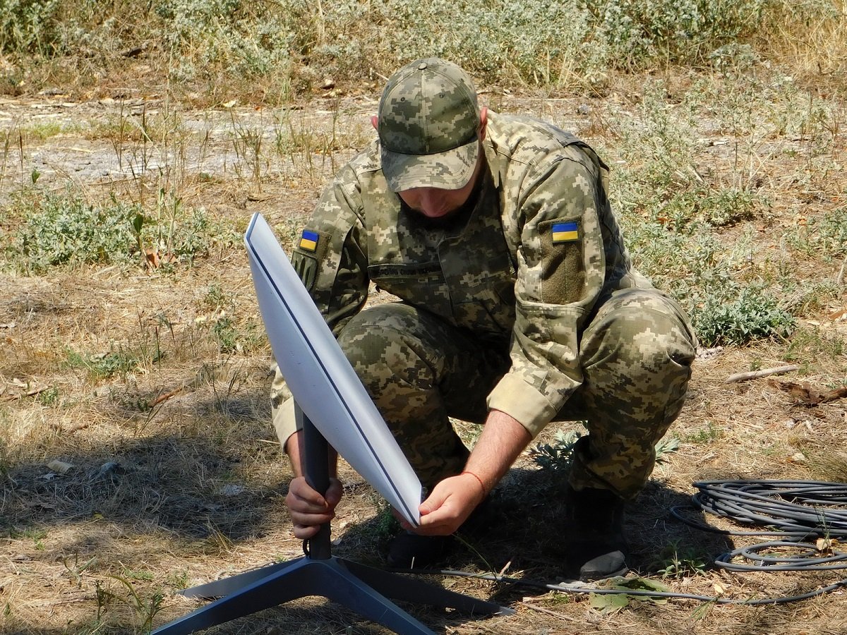 Support Forces of Ukraine soldier installing a Starlink terminal